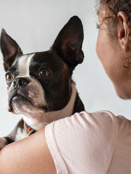 A girl holding a dog